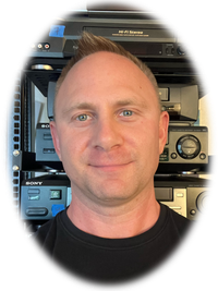 Oval headshot of the owner's face, with a backdrop of rackmounted VCRs.