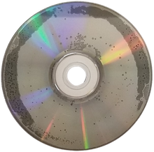 A disc with small dark pits around the perimeter